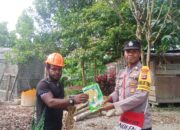 Dorong Ketahanan Pangan, Bhabinkamtibmas Kampung Hangaitji Bagikan Bibit Jagung dan Kacang Tanah