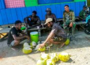 Semangat dan Keakraban: Warga Menyambut Hangat Tim Satgas TMMD dengan Kelapa Muda